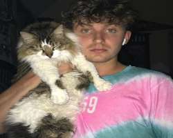 Ryan has adopted a cute black and white cat in his home.